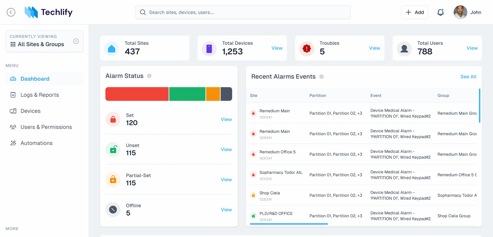 Dashboard with the full sidebar showing labelled menu items; the Recent Alarms Events table has Site, Partition, Event and Group columns, with group names cut off